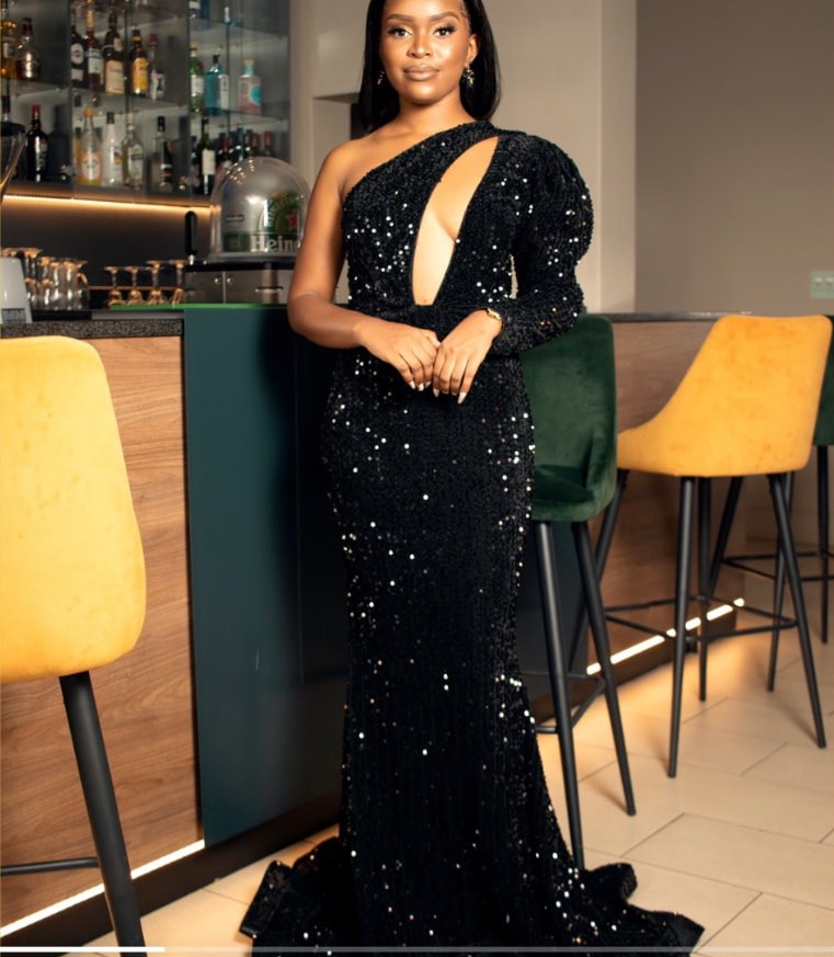 Model in a black sequinned mermaid dress
